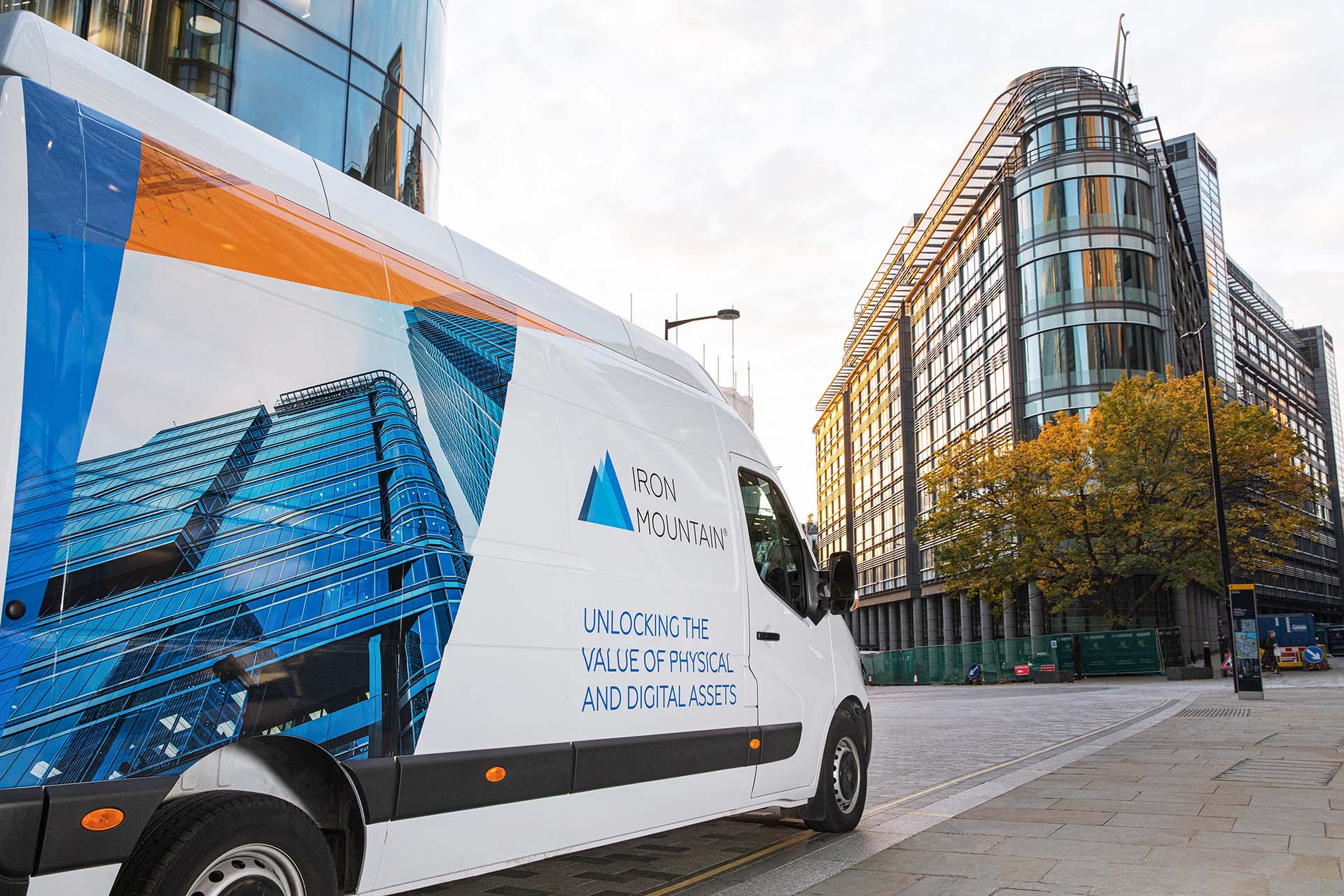 Iron Mountain van pictured with a modern building in the background