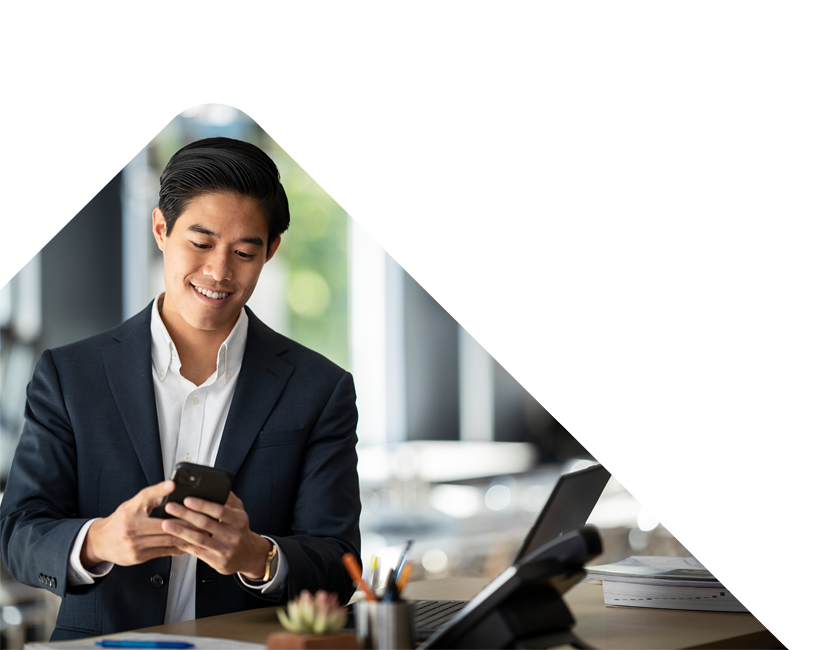 Business man smiling at phone