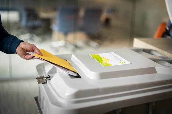 Iron Mountain shredding content going into bin