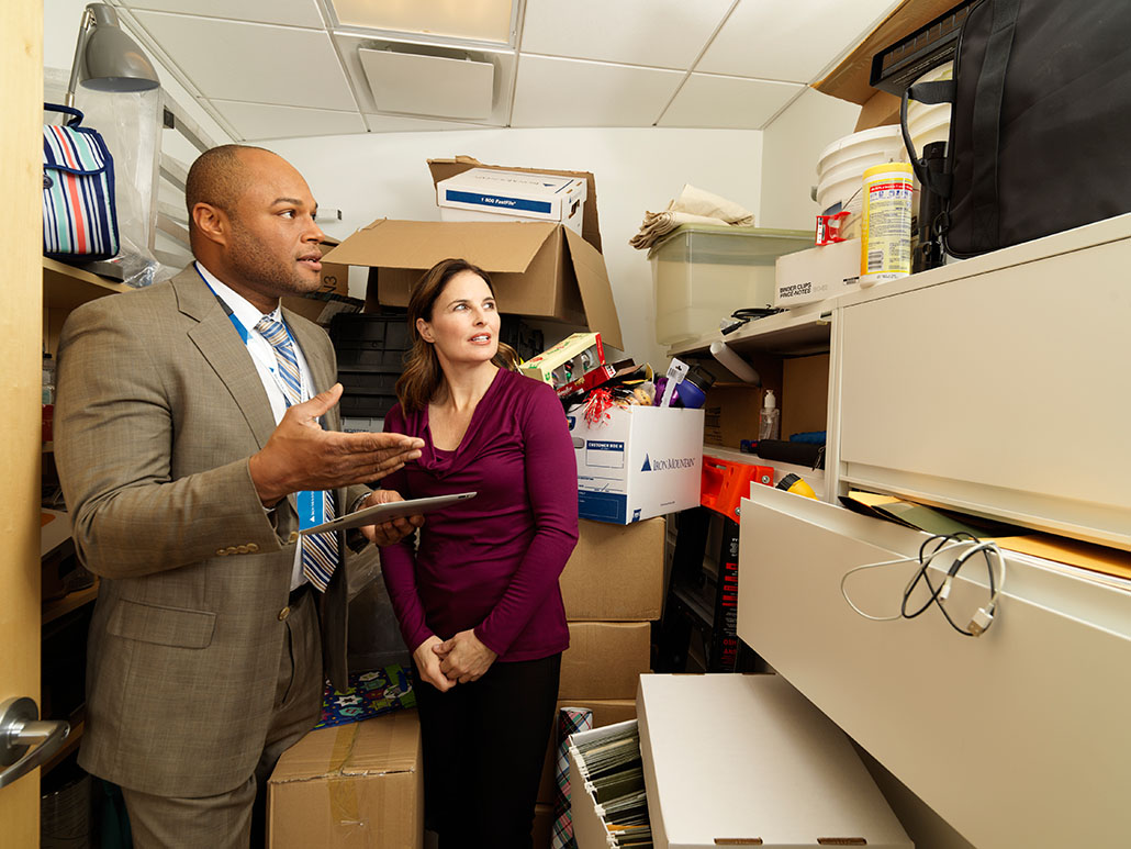 IM Employee and Customer evaluating office closet space