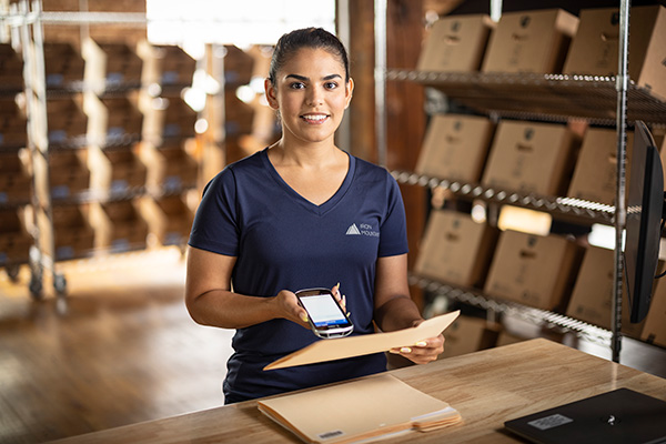 portrait of IM worker with files